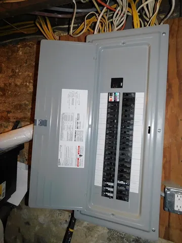 a living room with furniture a rug and a fireplace