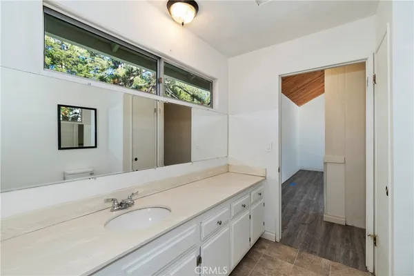 a bathroom with a double vanity sink and mirror