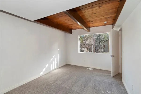 a balcony with wooden floor and deck