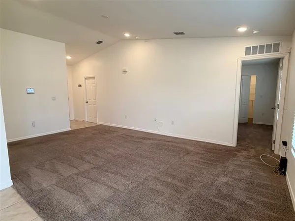 an empty room with a bathroom