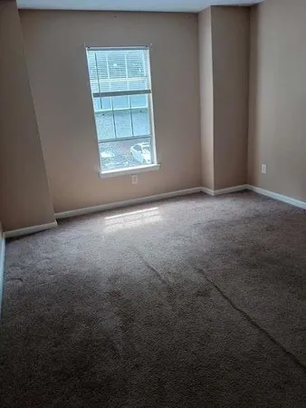 a view of hall way with mirror