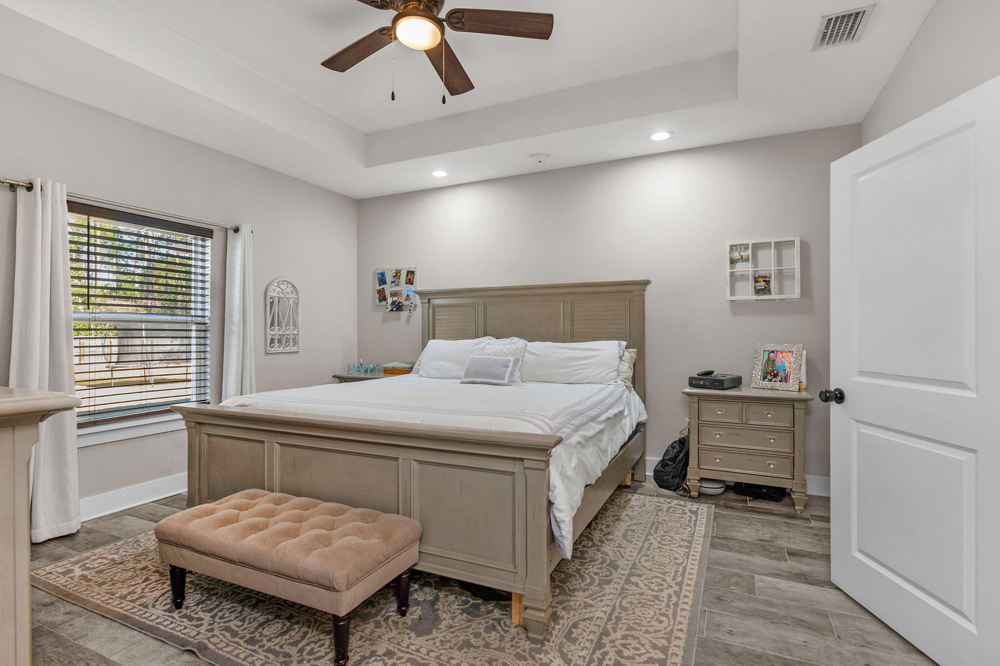8914 Timber Lane Navarre, FL 32566 - Photo 17 of 40 a bedroom with a bed and a dresser
