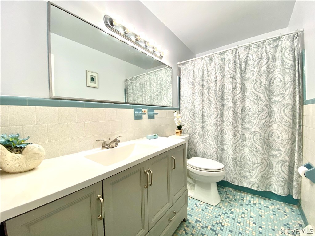 4210 Treely Road Chester, VA 23831 - Photo 15 of 39 a bathroom with a sink a toilet and a mirror