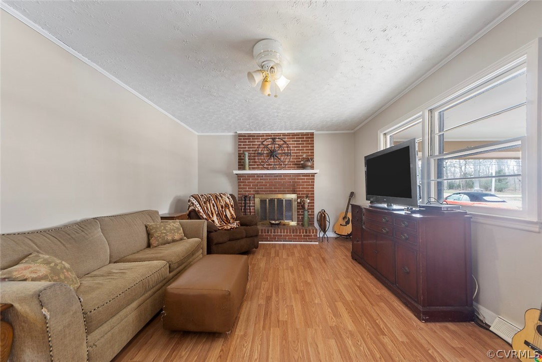 4210 Treely Road Chester, VA 23831 - Photo 16 of 39 a living room with furniture and a flat screen tv