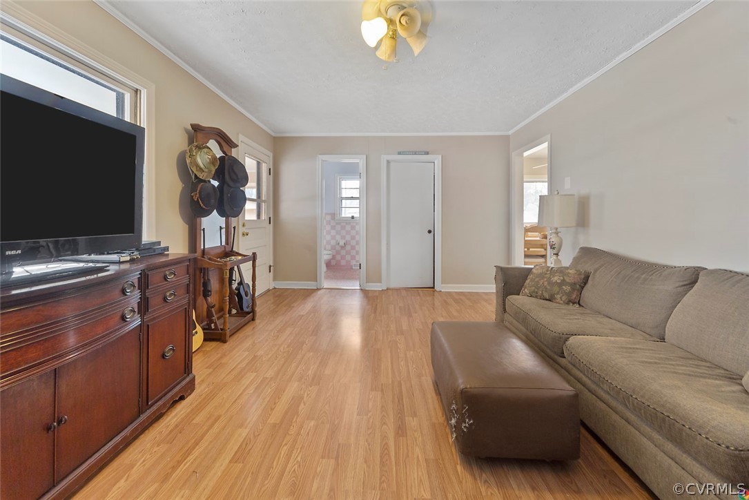 4210 Treely Road Chester, VA 23831 - Photo 18 of 39 a living room with furniture and a flat screen tv