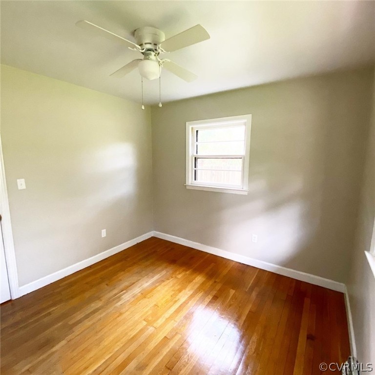 4210 Treely Road Chester, VA 23831 - Photo 22 of 39 an empty room with a window and a ceiling fan