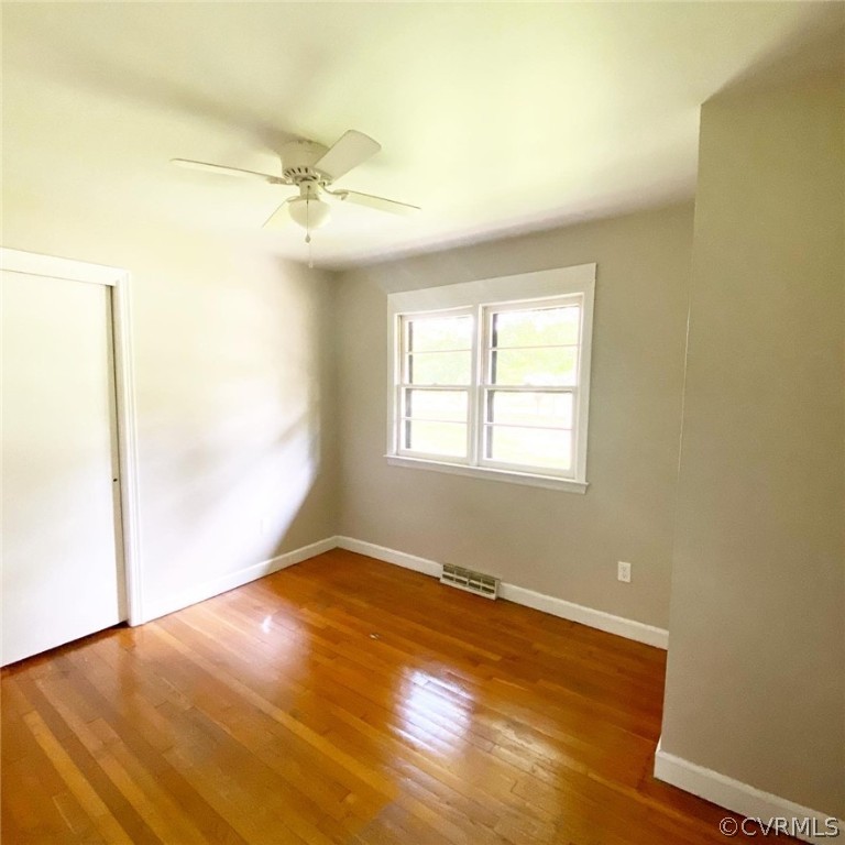 4210 Treely Road Chester, VA 23831 - Photo 23 of 39 an empty room with windows and fan