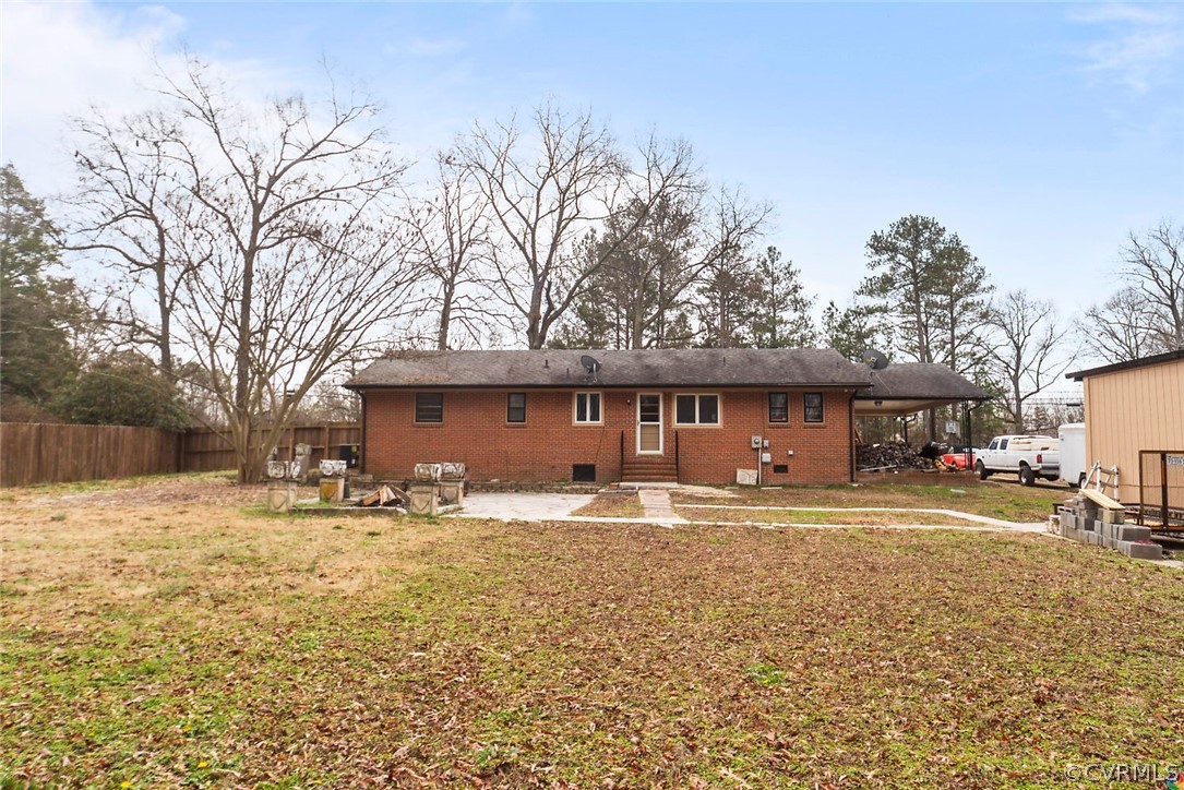 4210 Treely Road Chester, VA 23831 - Photo 32 of 39 a front view of a house with a yard covered with snow and trees