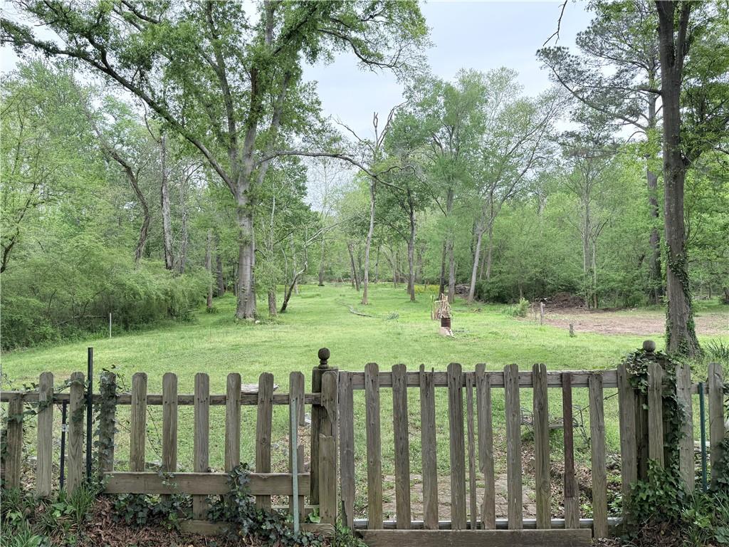 3033 Riviera Drive Conyers, GA 30012 - Photo 67 of 79 a view of a wooden deck with a trees
