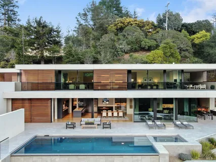 a view of house with outdoor sitting space