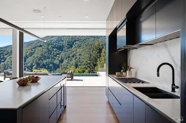 a room with a table or chairs and a floor to ceiling window