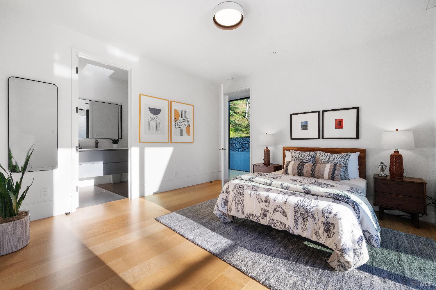 70 Ridgecrest Road Kentfield, CA 94904 - Photo 20 of 29 a bedroom with a large bed and a couch