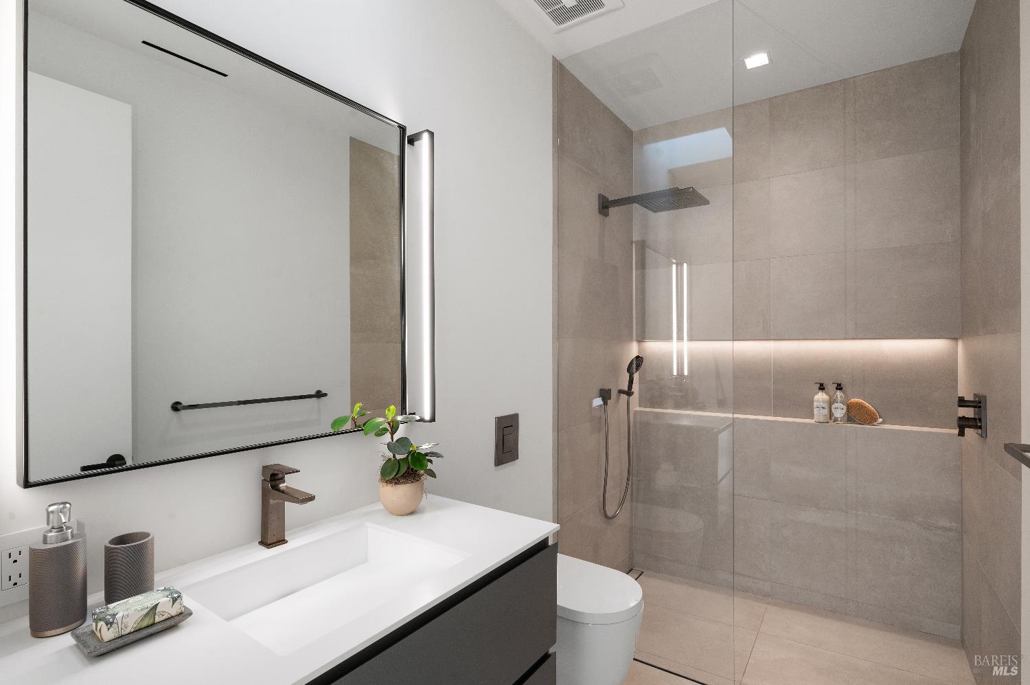 70 Ridgecrest Road Kentfield, CA 94904 - Photo 21 of 29 a bathroom with a granite countertop sink a toilet and shower