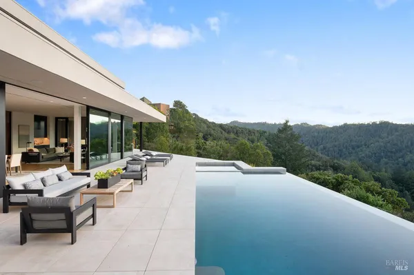 a terrace patio with couch and city view