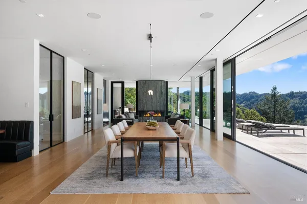 a view of a dining room with furniture window and outside view