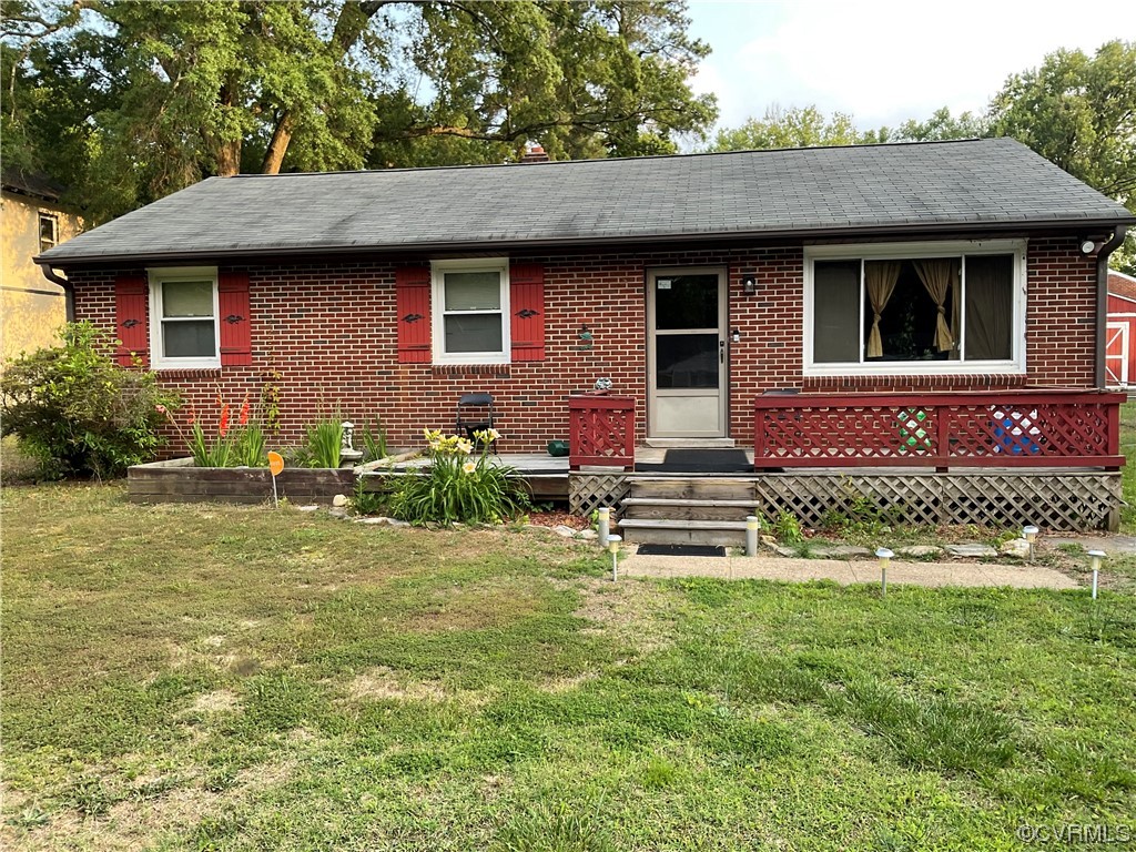 2737 Sherbourne Road Richmond, VA 23237 - Photo 1 of 3 a front view of a house with garden
