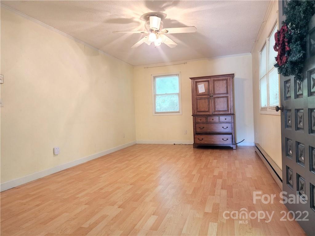 291 Cherokee Way Marion, NC 28752 - Photo 14 of 14 wooden floor in an empty room with a window