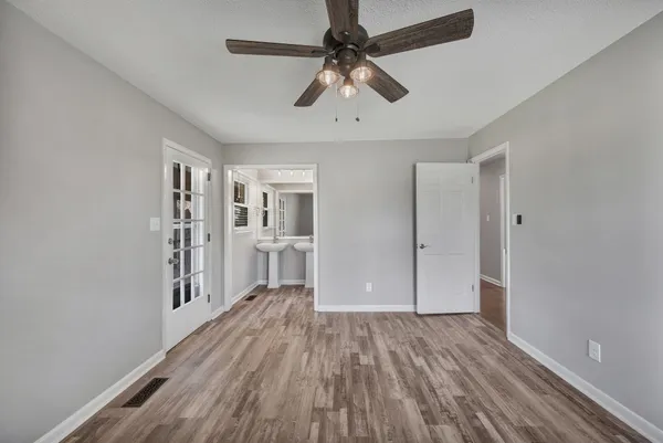 a bathroom with a shower and toilet