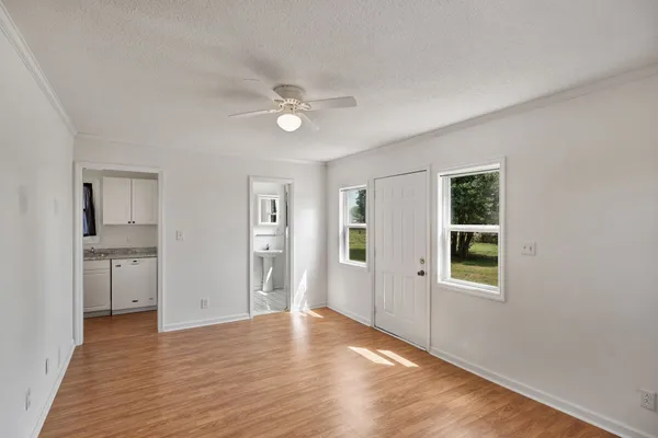 a kitchen with granite countertop a stove and a microwave
