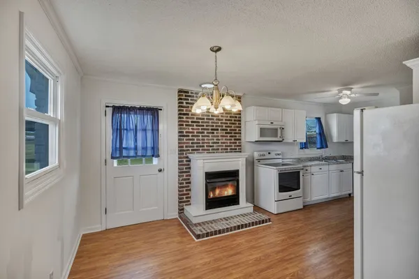 a view of a field with an trees