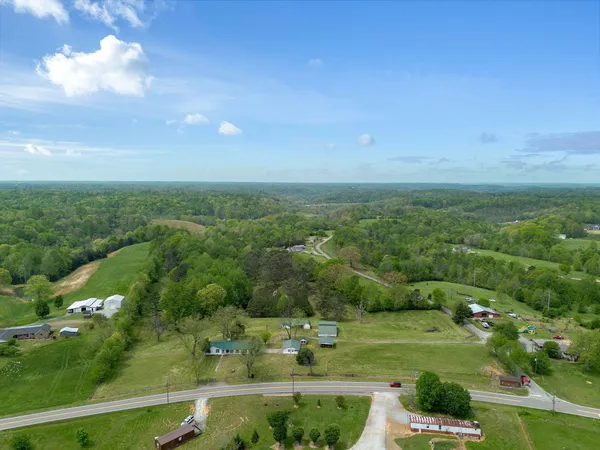 a view of a house with backyard and entertaining space