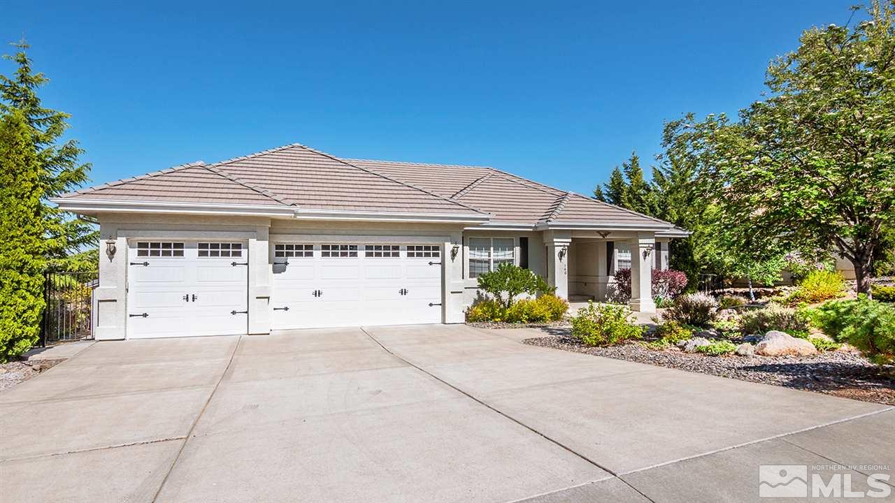 140 Gazelle Road Reno, NV 89511 - Photo 3 of 26 a front view of a house with a garden and potted plants