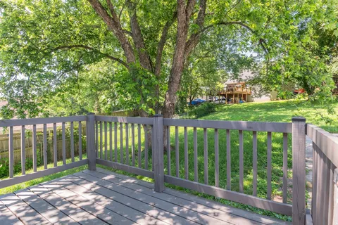 a view of a deck with a backyard