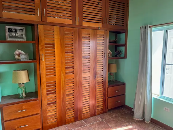 a view of a bedroom with a dresser