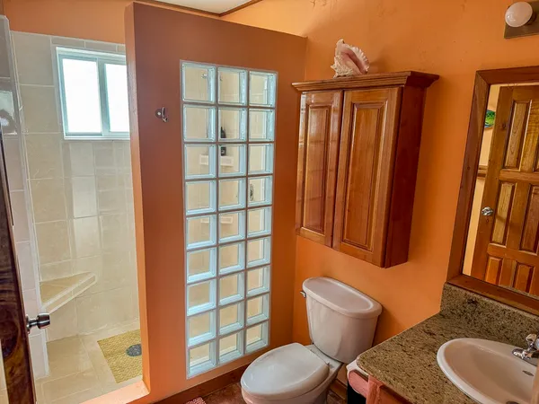 a bathroom with a toilet and a sink