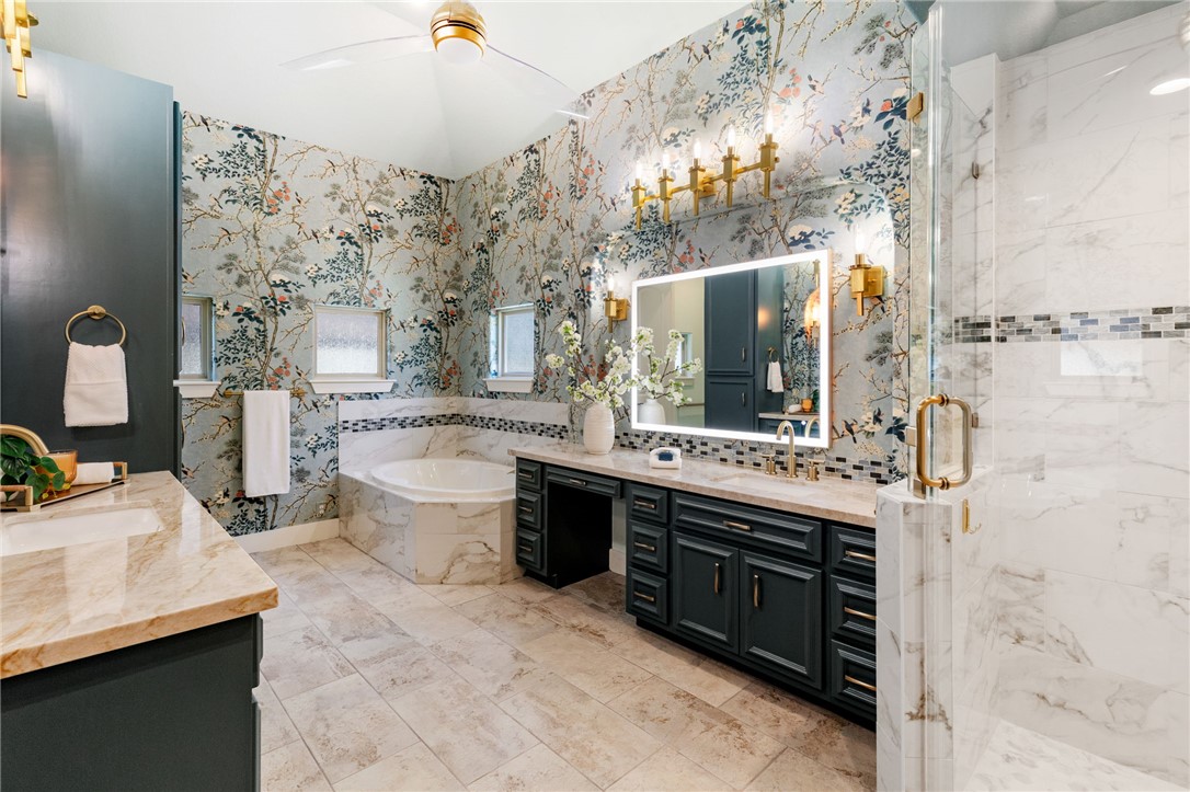 2833 Persimmon Ridge Court Bryan, TX 77807 - Photo 41 of 50 a spacious bathroom with a sink double vanity and a mirror