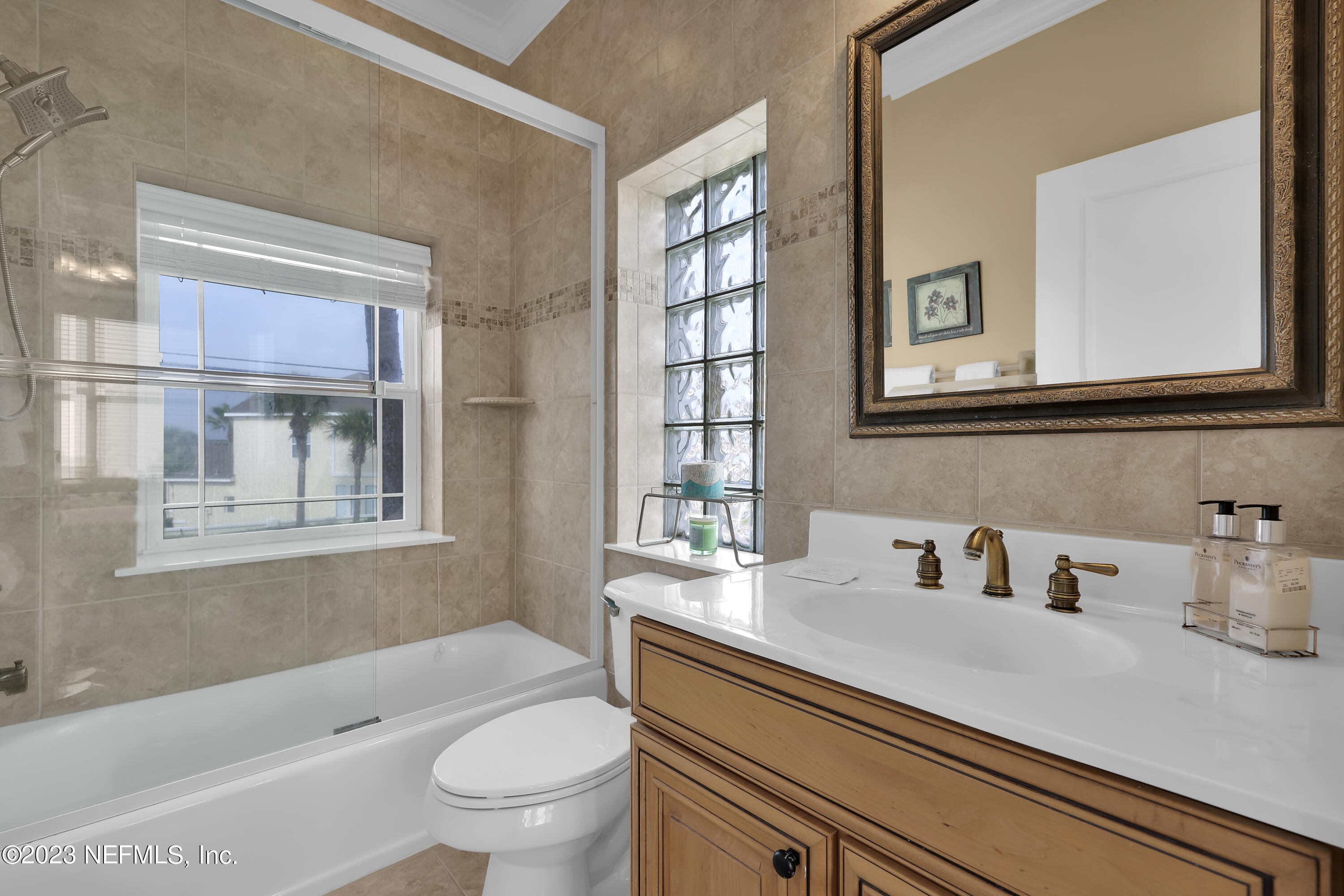 4582 Coastal Highway St. Augustine, FL 32084 - Photo 23 of 45 a bathroom with a sink a toilet and a bathtub