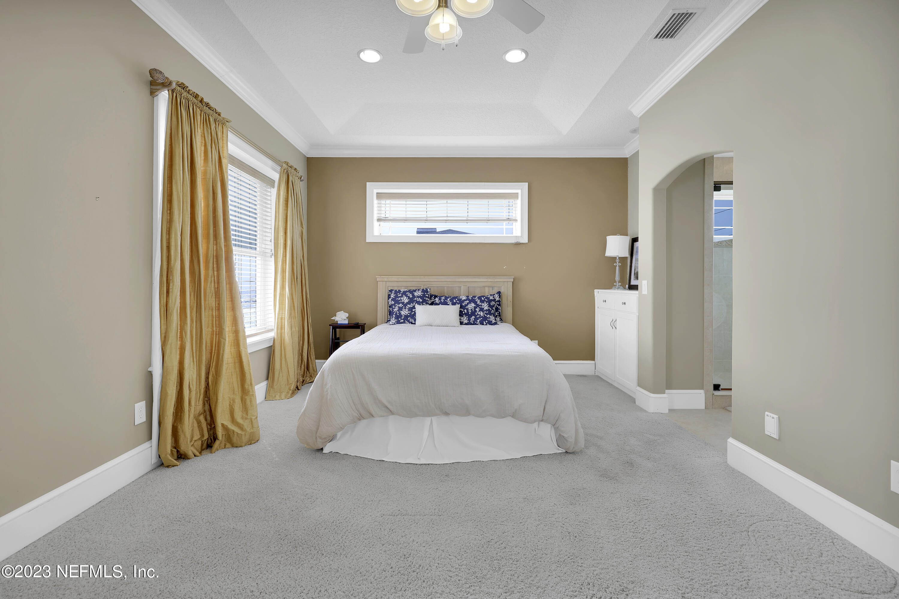 4582 Coastal Highway St. Augustine, FL 32084 - Photo 26 of 45 a bedroom with a bed and a window