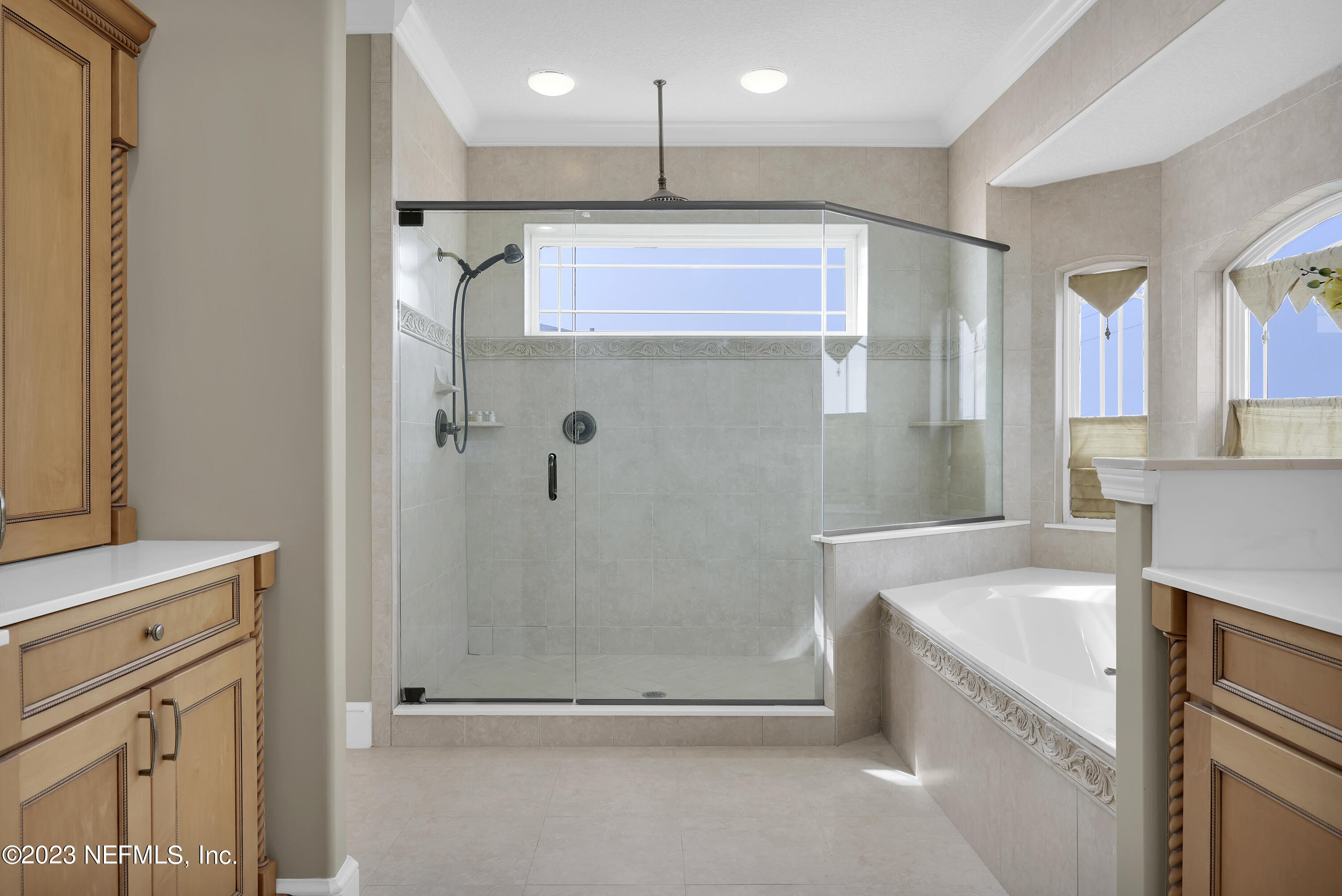 4582 Coastal Highway St. Augustine, FL 32084 - Photo 31 of 45 a bathroom with a sink a toilet and shower