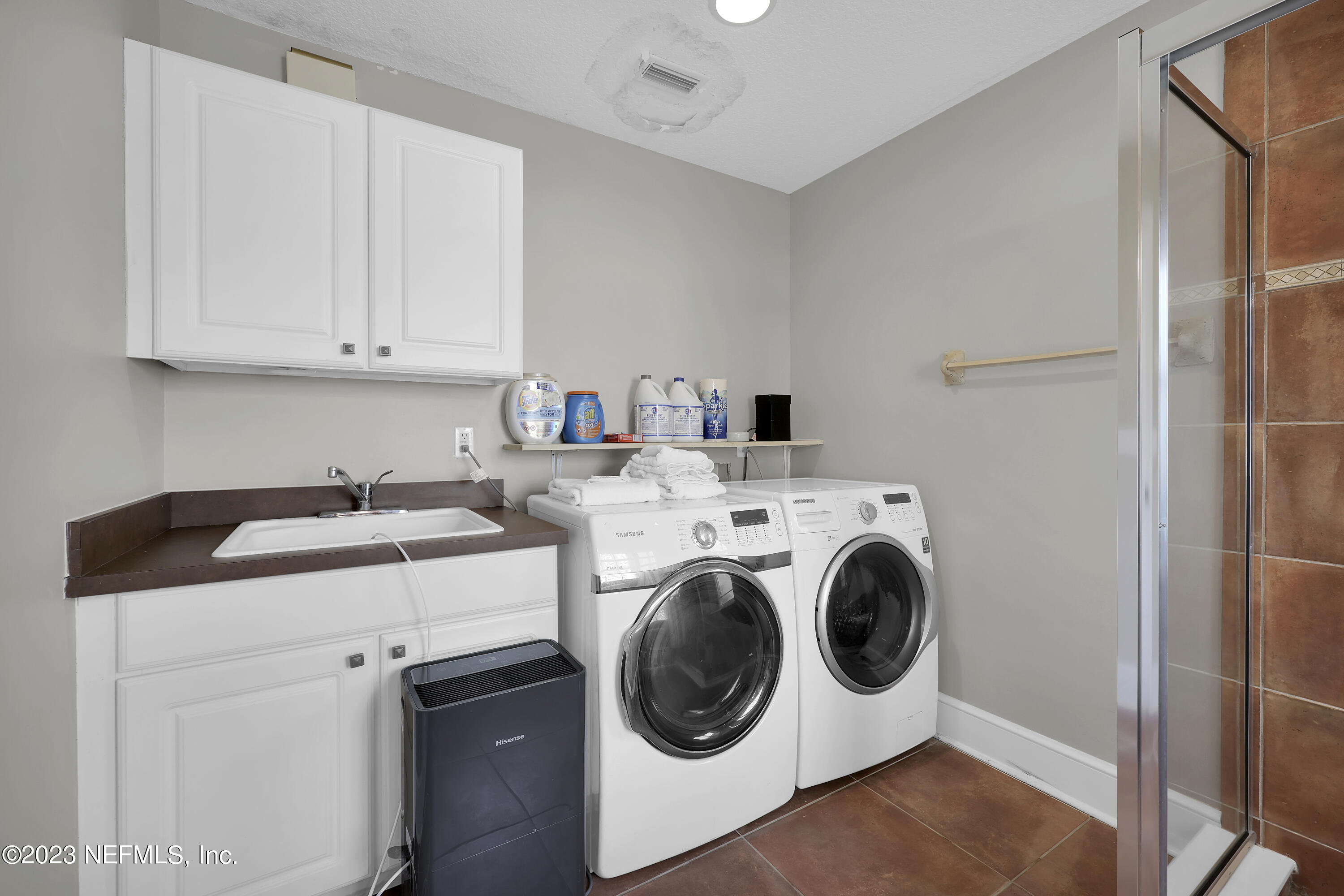 4582 Coastal Highway St. Augustine, FL 32084 - Photo 38 of 45 a utility room with dryer and washer