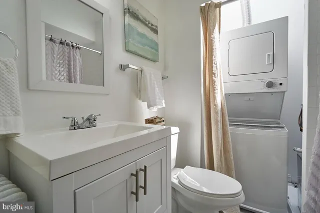 a bathroom with a sink toilet and vanity