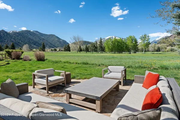 a view of a patio and yard