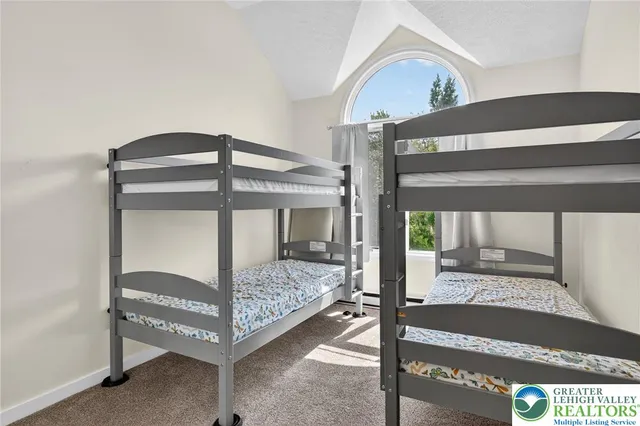 a room with lots of furniture and a window