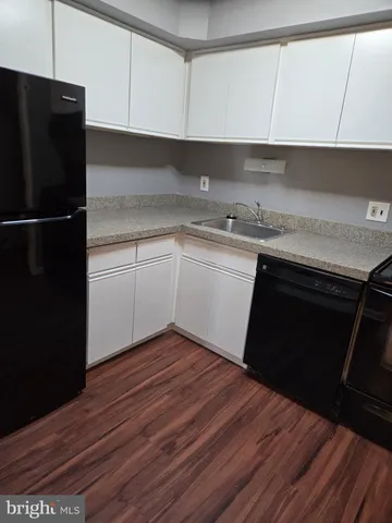 a white toilet sitting next to a shower curtain