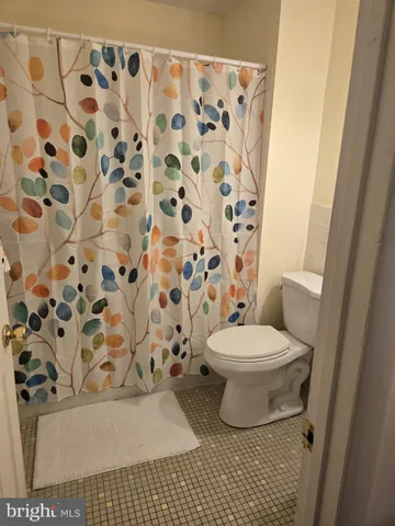 a bathroom with a shower curtain