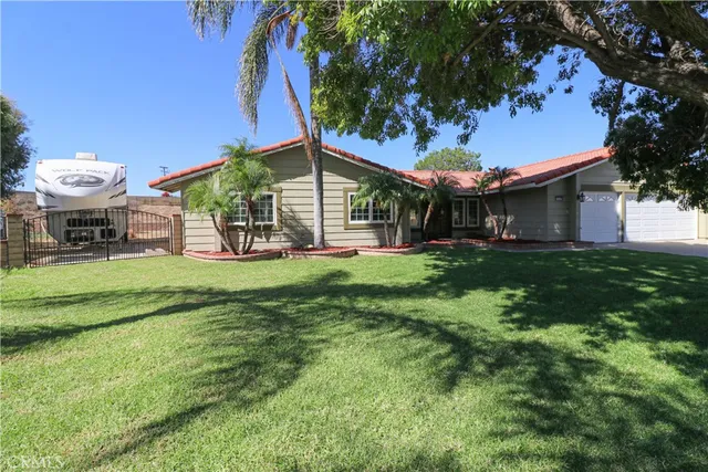 a view of a house with a yard porch and sitting area
