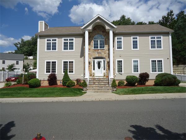 0 Ridge Road Revere, MA 02151 - Photo 3 of 5 a front view of a house with a yard and garage