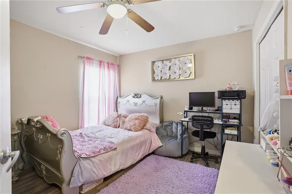 a bedroom with a bed and furniture
