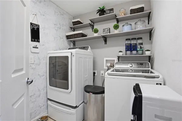a utility room with dryer and washer