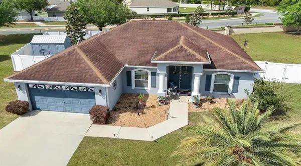 a view of house and outdoor space with swimming pool