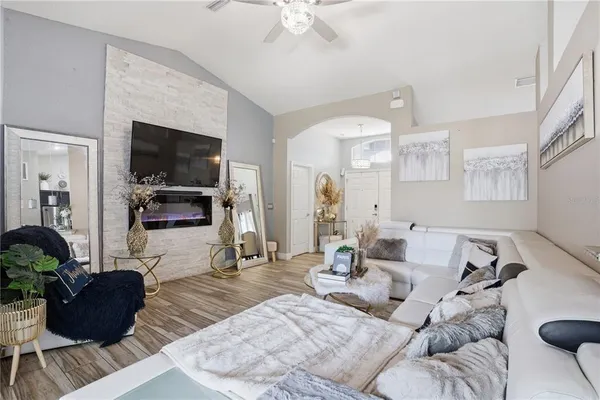 a living room with furniture and a flat screen tv