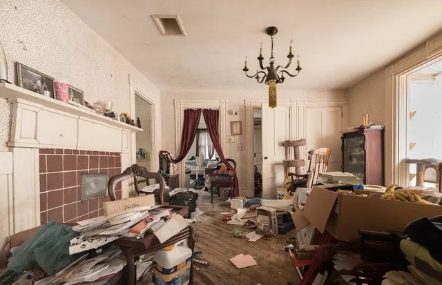 a view of a livingroom with furniture and a window