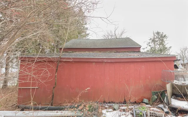 a view of a wooden door and covered with wooden fence