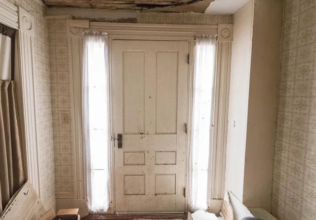 a view of front door with hallway