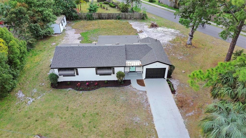 201 Valencia Road DeBary, FL 32713 - Photo 1 of 1 an aerial view of a house with yard and a patio