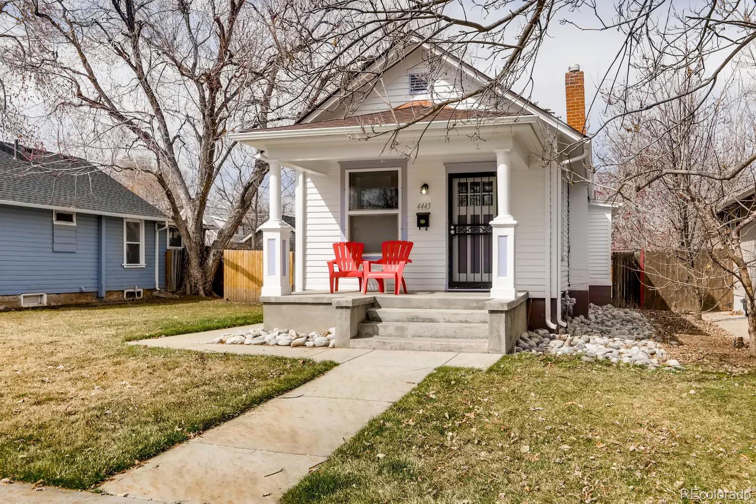 4445 Perry Street Denver, CO 80212 - Photo 1 of 19 a front view of a house with a yard